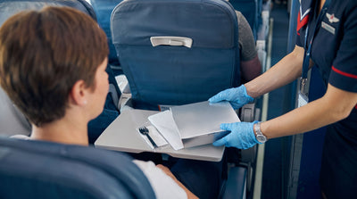 The Airline Tray Table Has Eight Times More Bacteria Than the Bathroom Flush Button